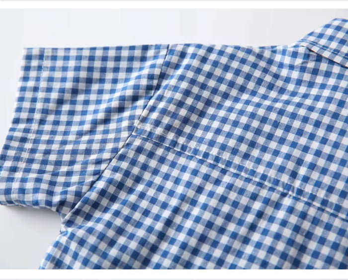 Three-quarter view of baby boy’s checked cotton shirt with matching tie – soft breathable finish