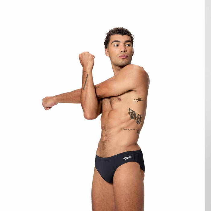Speedo men's Endurance+ logo brief in anthracite, 2.5-inch cut, showing the sleek swimwear with Speedo branding.