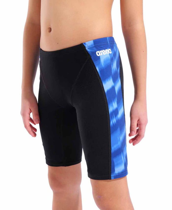 Black and royal blue Arena boys' Wave swim jammer showing a close-up of the fitted swimwear with the Arena logo.