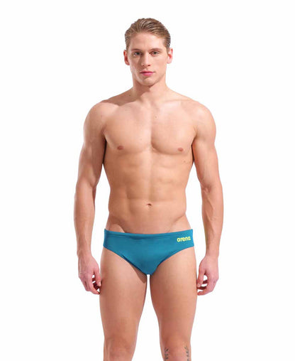 Arena men's team swim briefs in Blue Cosmo and Arctic Lime, featuring a snug fit and quick-drying fabric for competitive swimming.