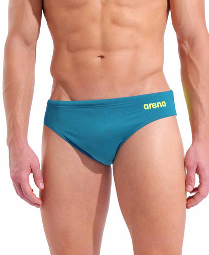 Blue Cosmo and Arctic Lime Arena men's swim briefs with a solid design, featuring a snug fit for competitive or recreational swimming.