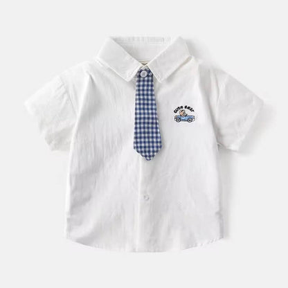 Close-up of baby boy’s checked cotton shirt pattern with matching tie – soft cotton detail