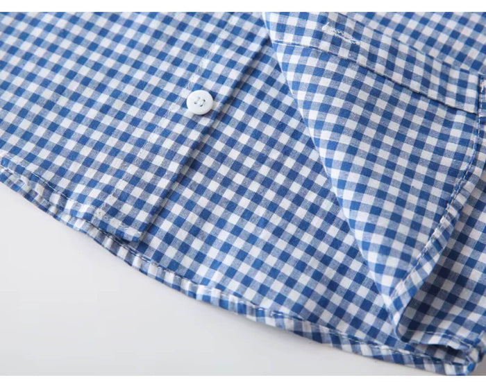 Close-up of fabric texture on baby boy’s checked cotton shirt
