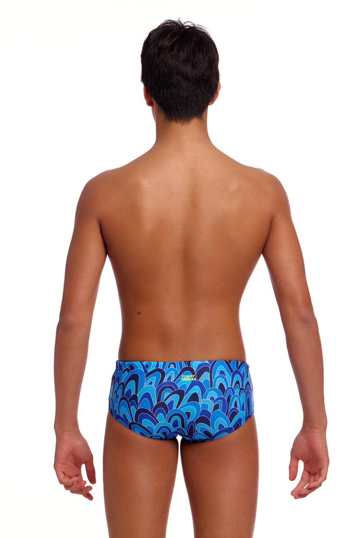 Funky Trunks boys Hill Billy Blues Sidewinder trunks in vibrant blue with fun, wavy patterns on the fabric.