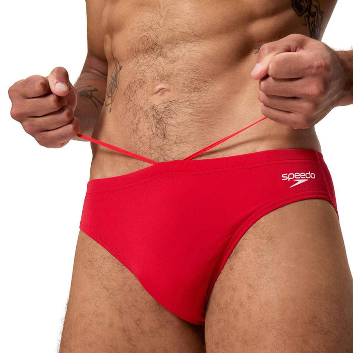Speedo men's Endurance+ logo briefs in high risk red, showing a close-up of the 2.5-inch waistband with logo detail.